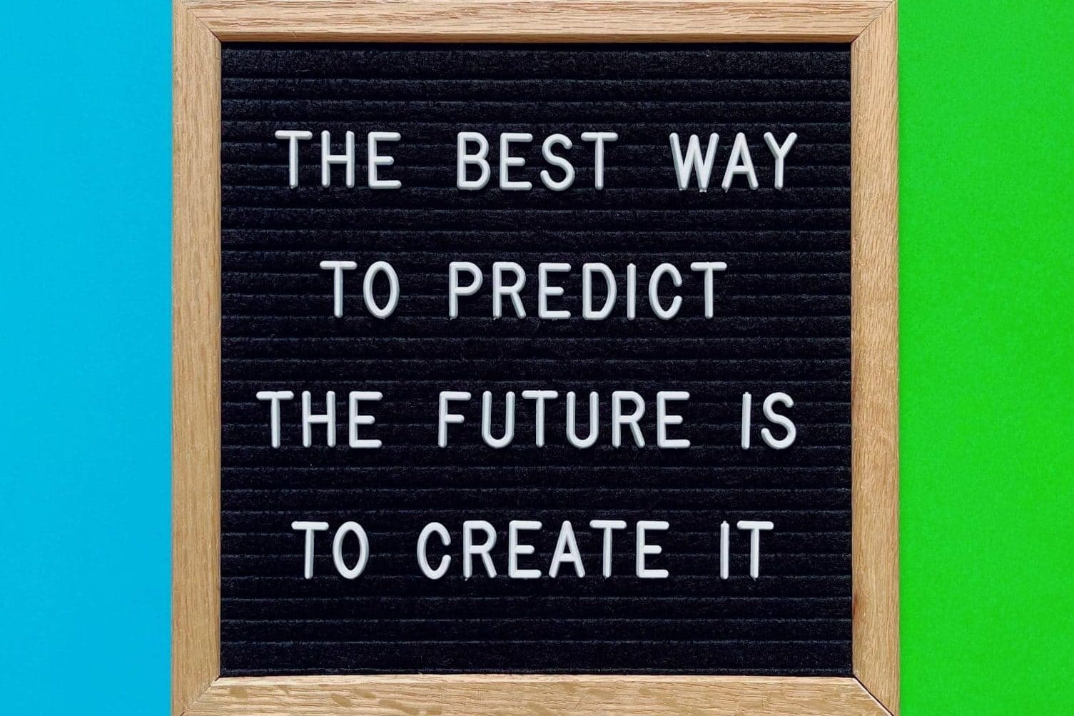  board with the quote “The best way to predict the future is to create it.”